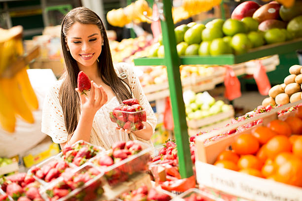 istock Young woman on the market 618649888