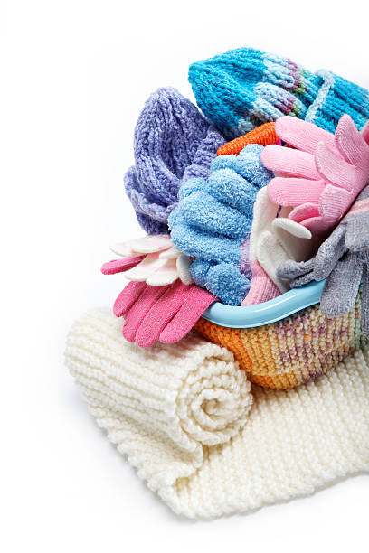 istock Winter accessory collection. Hat, scarf and mittens in the conta 618650420