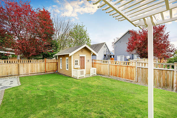 Small wooden shed in the back yard Small wooden shed in the back yard of American house. Northwest, USA shed stock pictures, royalty-free photos & images