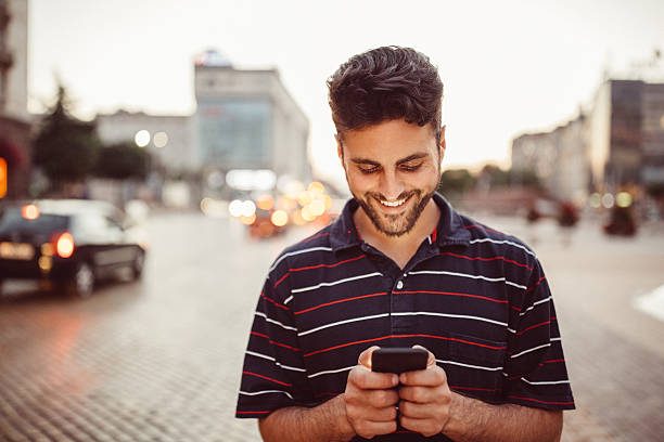 istock Smiling man in the city 618652628