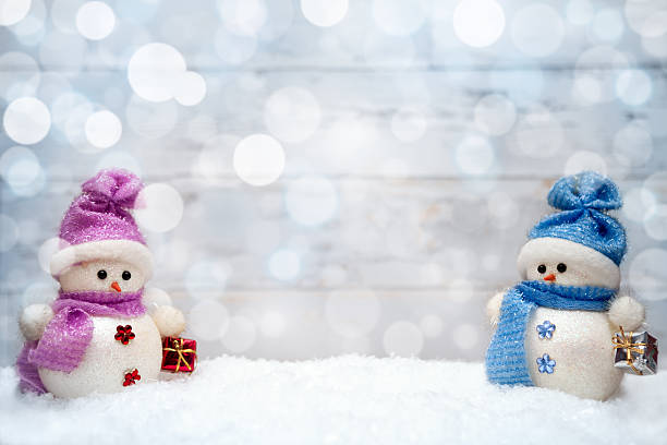 istock Christmas snowmen couple with presents 618653428