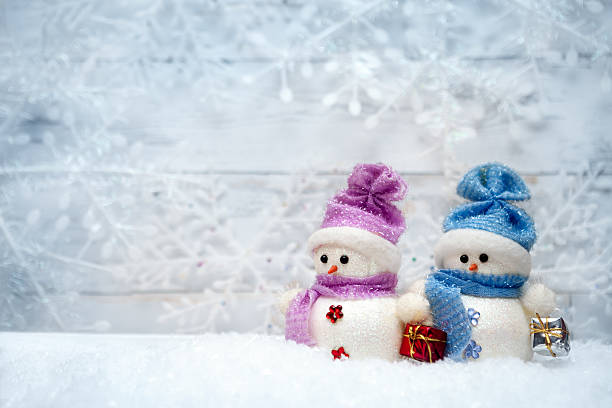 istock Festive snowmen on winter background 618653518