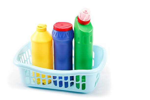 istock Detergent bottles, rubber gloves and cleaning sponge on a white 618653694