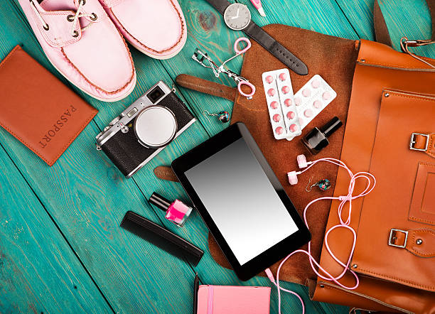 istock shoes, tablet pc, camera, bag, notepad, headphones, watch, pills, passport 618654428