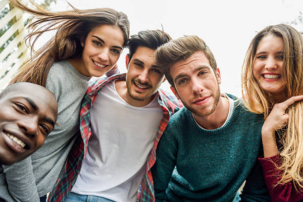 istock Multiracial group of friends taking selfie 618719222