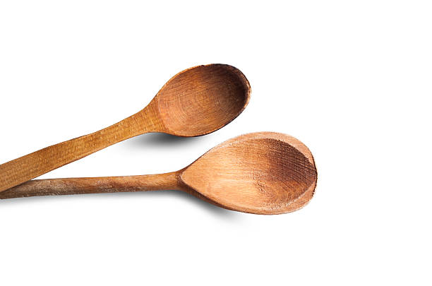 istock Two wooden spoons isolated on white background 618719722