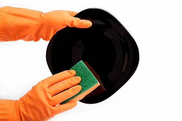 istock Hands in rubber gloves can sponge the plate 618720122