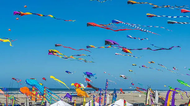 Photo of Colorful kites against a blue sky