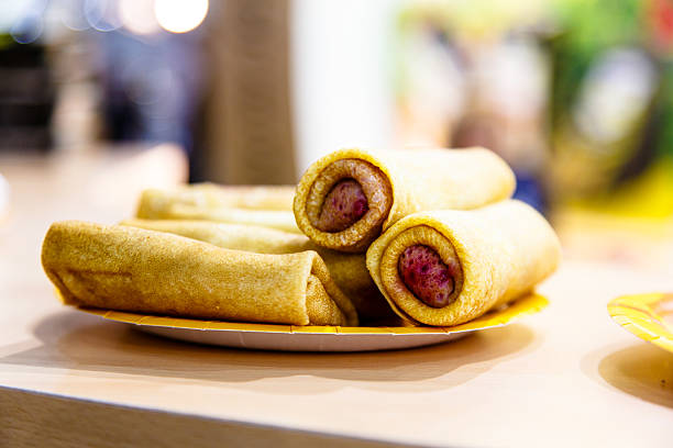 istock Rolls of Russian pancakes stuffed with berries and cheese. Beaut 618722498