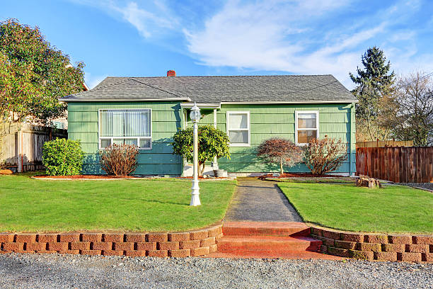istock Green Suburban Bungalow style home 618724952