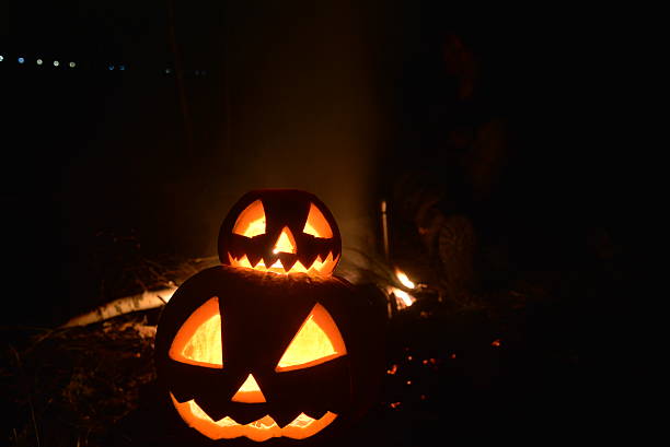 istock two halloween jack heads on dark backround 618725106