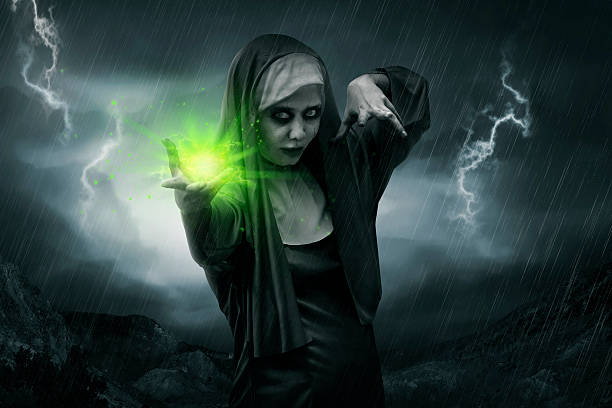 Scary asian nun casting spell Scary asian nun casting spell. Halloween concept image angry nun stock pictures, royalty-free photos & images