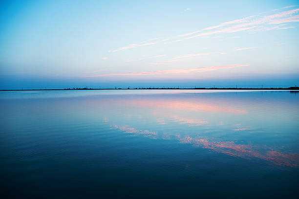 istock Reflections of sunset with cloudscape in lake water 618725930