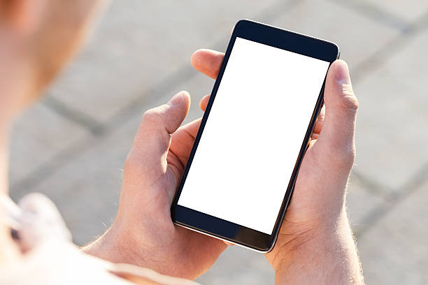 istock Man uses his Mobile Phone outdoor, close up 618726404