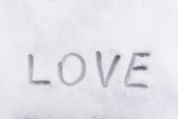 Concept of the Love, word sign writen on the snow at cold winter