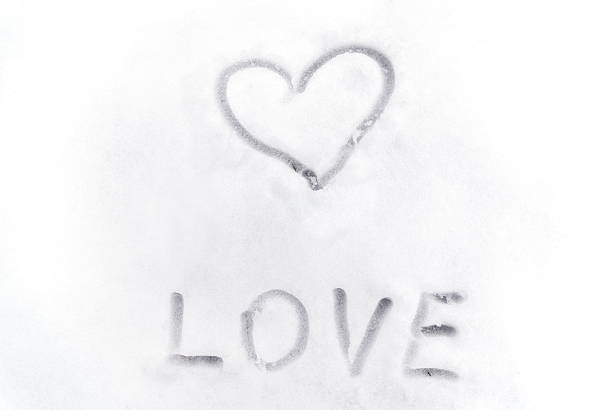 istock Love heart sign writen on the snow 618726718