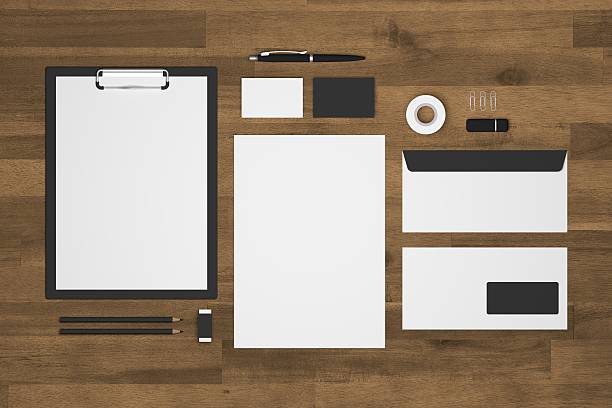 istock Blank 3d illustration stationery with black and white on wood 618726992