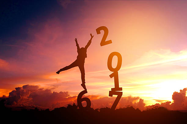 istock Silhouette young man Happy for 2017 new year 618730254