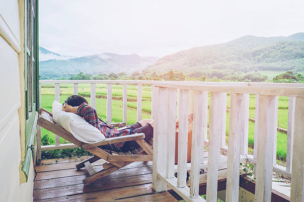 istock Young man relax on bed and enjoying on day 618730352