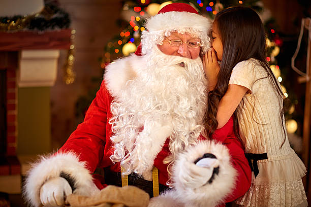 istock Santa Claus and Little girl 618730516