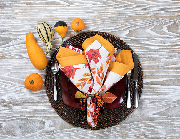 istock Dinner setting for autumn season with gourd decorations on aged 618730562