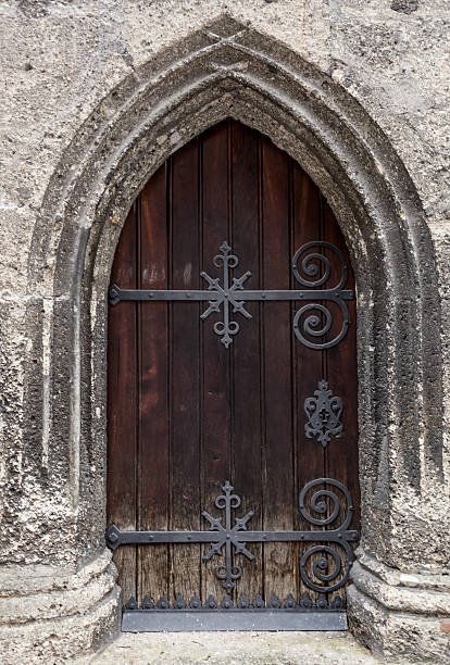 istock old oak door at ancient stone cathedral 618732720