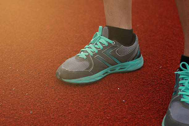istock Legs of a man stand on the track 618734268
