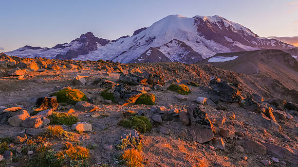 istock Snowy peaks. The sun's rays illuminate the rocks 618735440