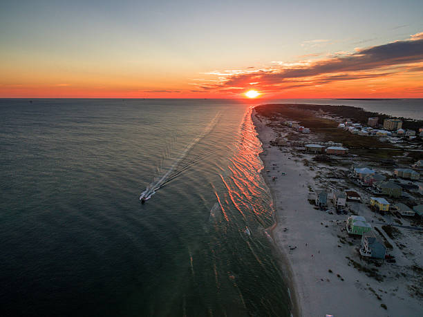 Aerial/Drone Photo of a beautiful sunset over Gulf Shores Alabama Gulf Shores is famous for its white sand beaches and great weather mobile bay stock pictures, royalty-free photos & images