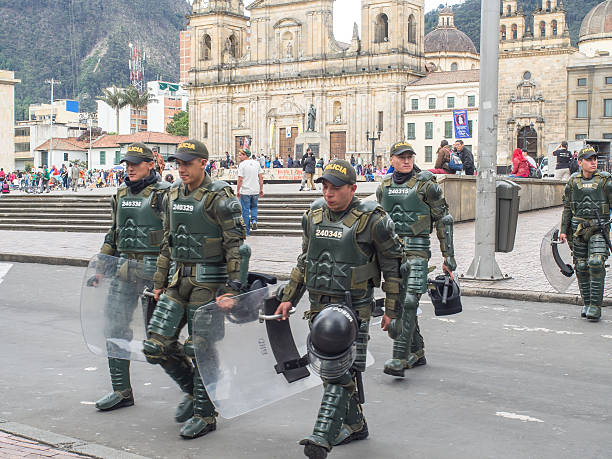 Bogota Bogota, Colombia - May 1, 2016: Armed riot police on the streets of Bogota Chest Protector stock pictures, royalty-free photos & images