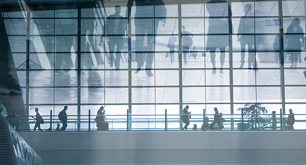 istock people walking in airport 618736188
