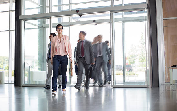 istock Group of business people on the way in building 618737270