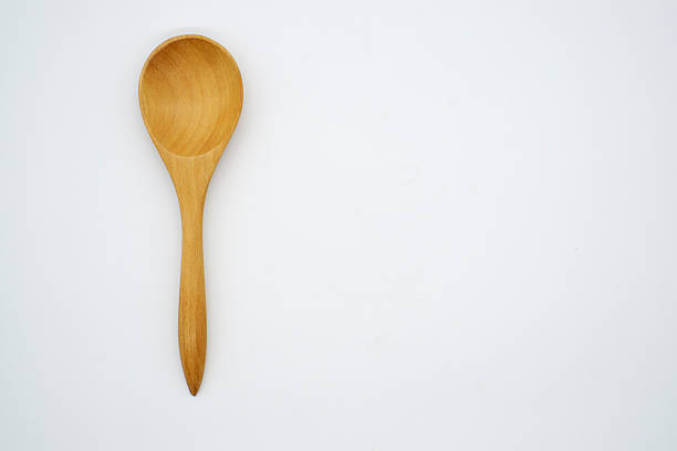 istock Close-up  wooden spoon isolated on white background 618738526