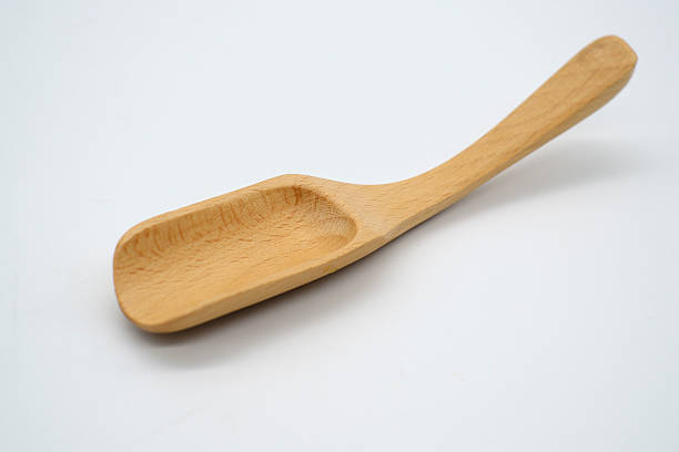 istock Close-up  wooden spoon isolated on white background 618738580