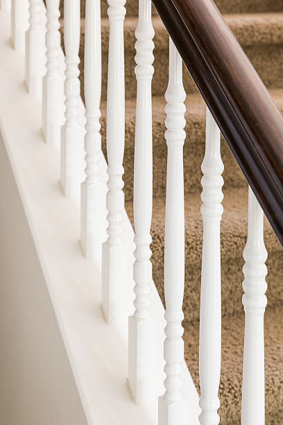 istock Abstract of Stair Railing and Carpeted Steps in House 618740270