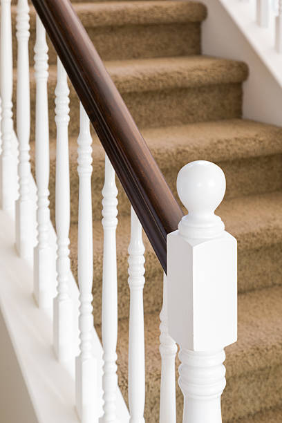 istock Abstract of Stair Railing and Carpeted Steps in House 618740292