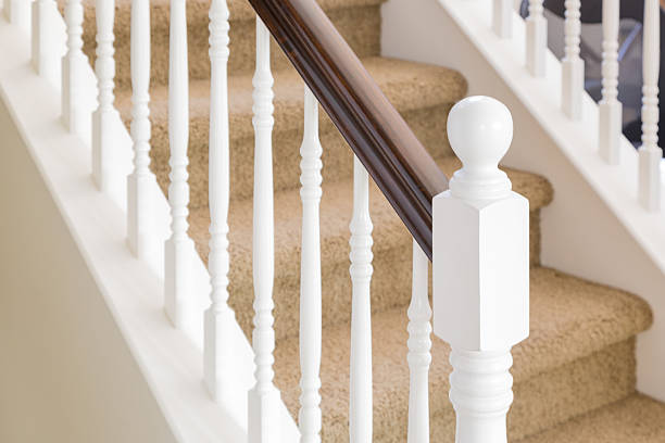 istock Abstract of Stair Railing and Carpeted Steps in House 618740324