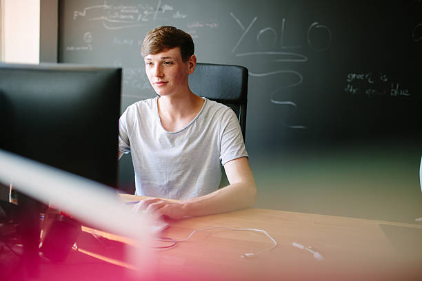 Young man working at his desk