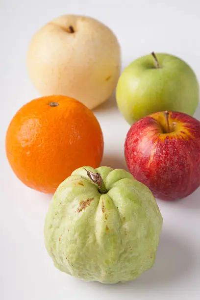 Five fruit , guava orange, redapple, green apple  chinese pear, on white background