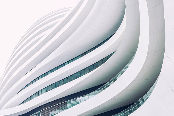 Futuristic architecture Beijing, China - August 22, 2014: Modern curved walkways and floors of the Galaxy Soho, a complex with office buildings, shopping mall, stores and restaurants. Galaxy Soho was designed by Zaha Hadid architects and opened in 2012. white buildings stock pictures, royalty-free photos & images