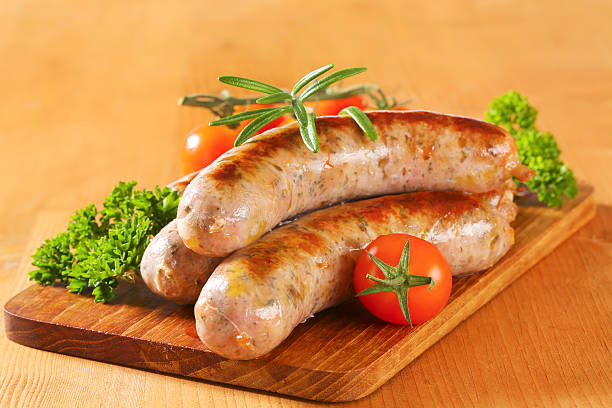 istock Grilled sausages on a cutting board 618744712