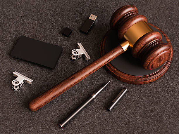 istock Judge's gavel, smartphone, business card on leather substrate. 3D illustration 618747838