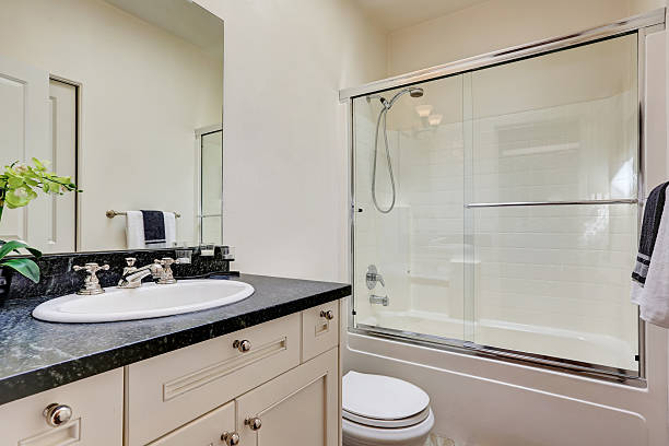 istock White bathroom interior with glass shower 618748414