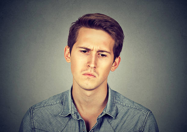 istock Portrait of a sad young man 618748618
