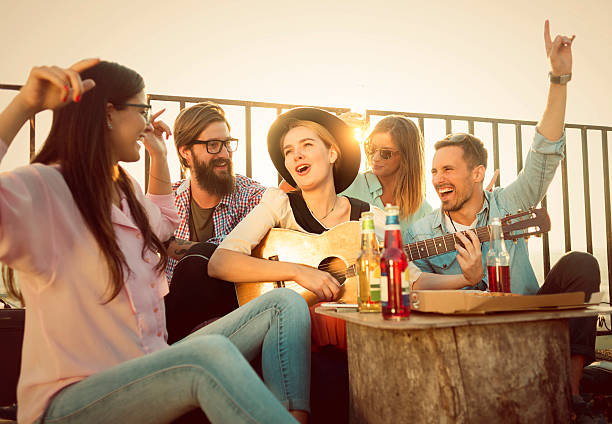 istock group of friends singing all togheter and having fun 618750232