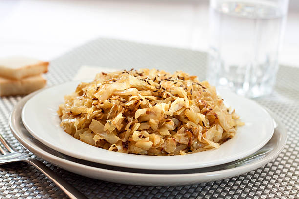 istock Fried cabbage with caraway and garlic on a plate 618751154