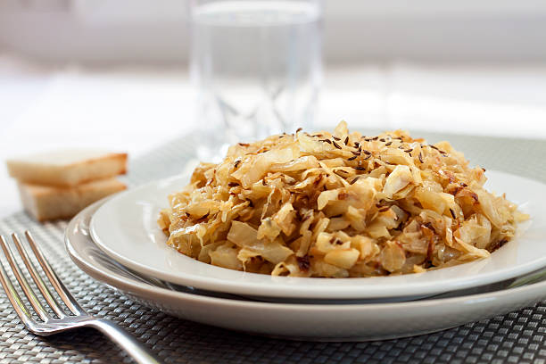 istock Fried cabbage with caraway and garlic on a plate 618751192