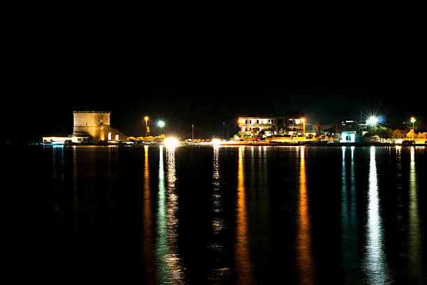 istock street lights at night on the sea 618751788