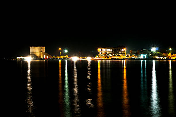 istock street lights at night on the sea 618752556