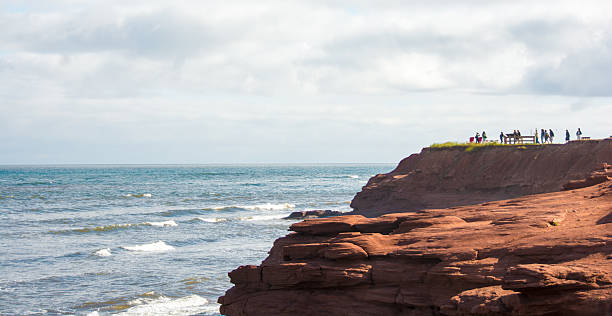 The tourist view point at Cavendish Beach The shoreline at Cavendish in Prince Edward Island National Park. The red rocks and sand are natural phenomenonsin the park. September cavendish beach stock pictures, royalty-free photos & images